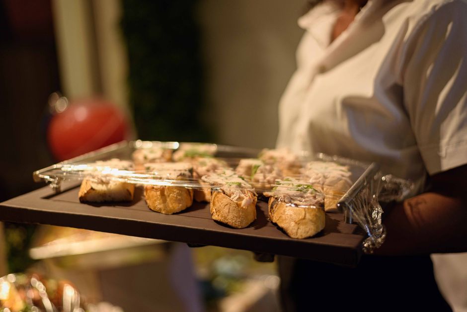 Waiter serving appetizers at a wedding reception